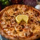 Pizza Al Tonno cu ton, ceapă și cașcaval + Pizzeria Mama Mia – Rețete italiene autentice. Livrare GRATUITĂ în Timișoara și comunele din jur.
